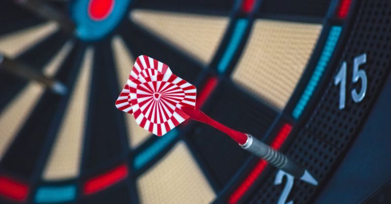 Asymmetrical Board Games - Red and White Dart on Darts Board