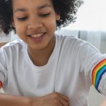 Educational Board Games - Happy black girl moving figurines on chess board