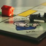 Board Games - Miniature Toy Car on Monopoly Board Game