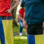 Collaborative Games - Two Men Doing The Sack Race