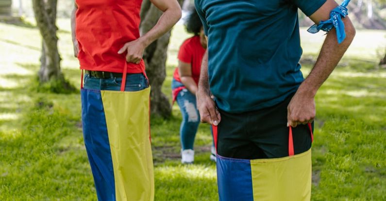 Collaborative Games - Two Men Doing The Sack Race