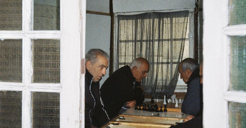 Themed Board Games - Men Playing Chess and Backgammon
