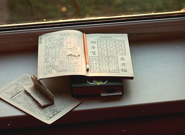 opened-book-on-brown-wooden-table